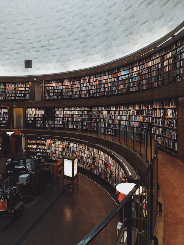 Explore a stunning circular library with endless bookshelves, offering a haven of knowledge and tranquility.